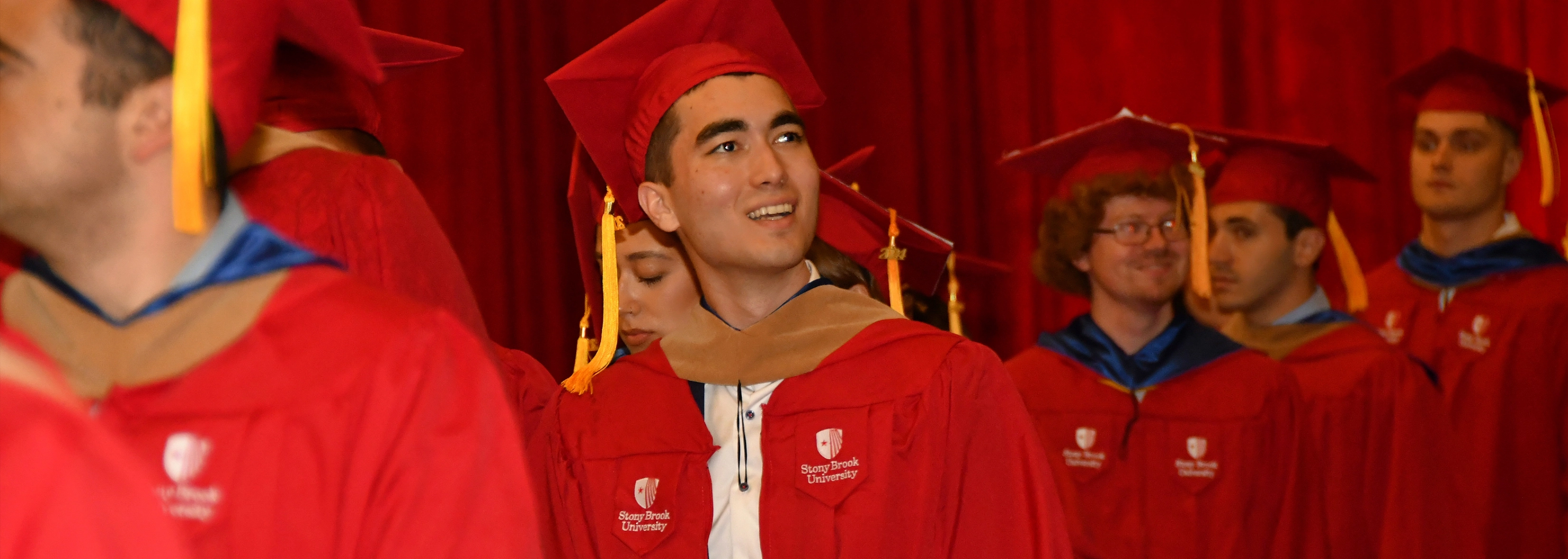 SUNY Stony Brook University College of Business Students at Convocation in their caps and gowns