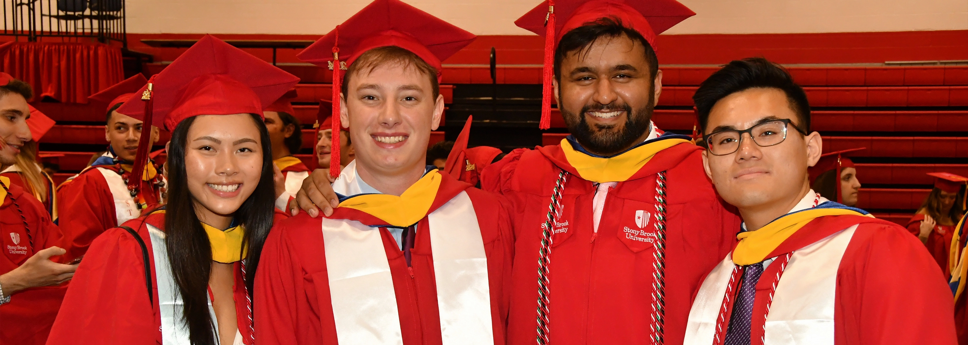 Wolfie at graduation in a cap and gown