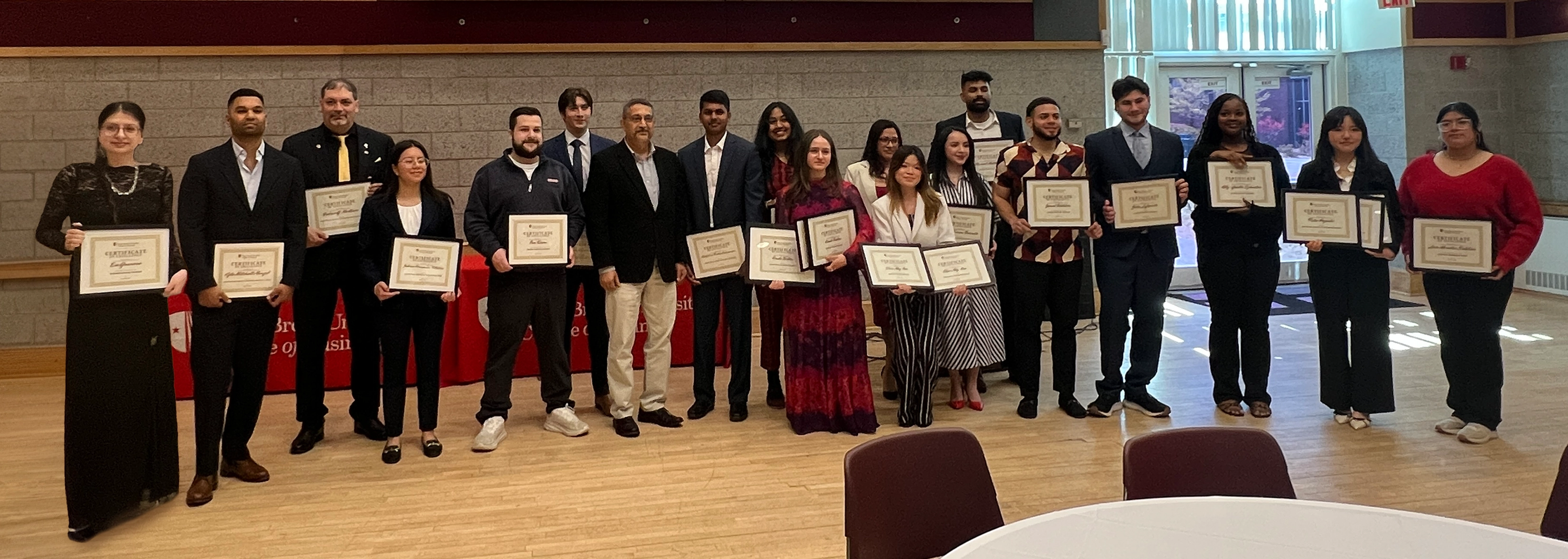 SUNY Stony Brook University College of Business Students at Convocation in their caps and gowns